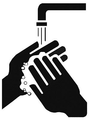 A black and white image of a person washing their handsDescription automatically generated